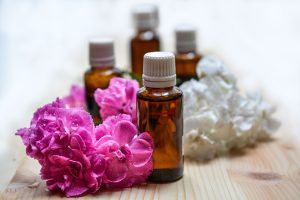 Essential oil bottles and flowers